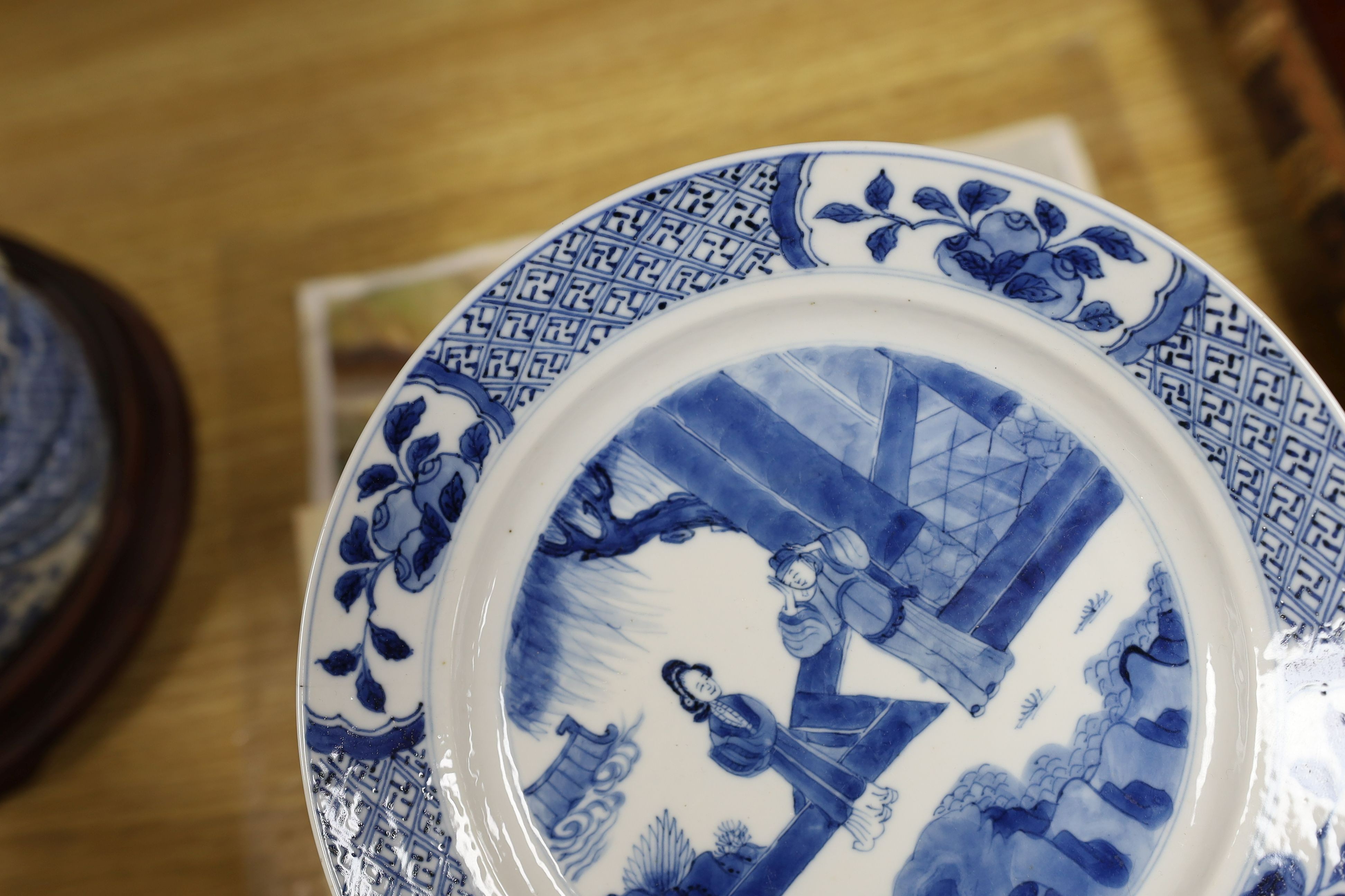 Two Chinese blue and white plates, Kangxi period, one with Kangxi mark the other a Chenghua mark, 21 cms diameter